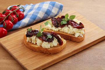 Bruschetta with soft cheese and tomato