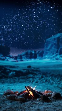 Vertical Video: No people at Night in the Canyon with Relaxing Campfire Fire Burning and Amazing Natural Landscape View with Marvelous Bright Milky Way Stars Shining on Mountains