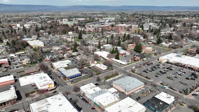 Cinematic 4K aerial drone dolly out shot of the Central Washington University, city of Ellensburg, Kittitas County in Western Washington