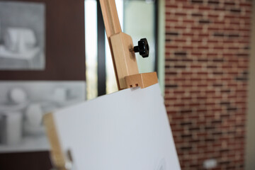 Drawing white canvas in empty creative school studio for class inspiration. Contemporary class with nobody in it ready for drawing lesson equipped with professional sketching tools