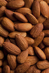 Composition from almond nuts isolated on white background