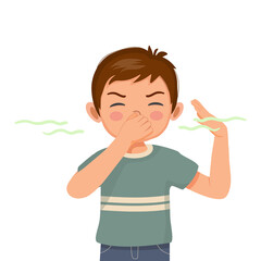 cute little boy pinching and cover his nose smelling something stinky and bad aroma holding breath with fingers on nose - obrazy, fototapety, plakaty