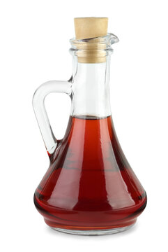 Decanter with red wine vinegar isolated on the white background