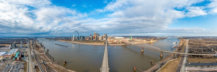 Drone panorama over St. Louis skyline and Mississippi River with Gateway Arch during daytime