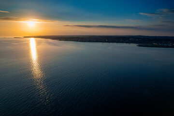 Sunset over Galway bay, Ireland. Beautiful blue sky and ocean and warm sun. Irish landscape