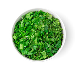 Fresh chopped greens in a bowl are isolated on a white background.