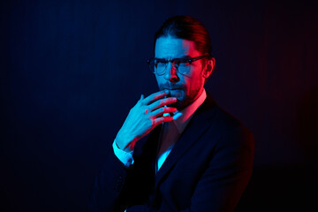 stylish man gestures with his hands with glasses isolated background