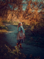 Girl walking in the autumn park