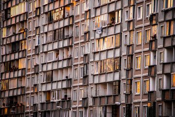 Reflection of a sunset in Soviet multistory building windows in Riga, Latvia