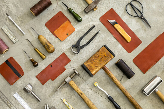 Top view materials and instruments on cutting mat for chopping measurement leatherwork details