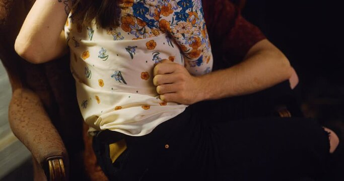 Couple touch each other as the make out.