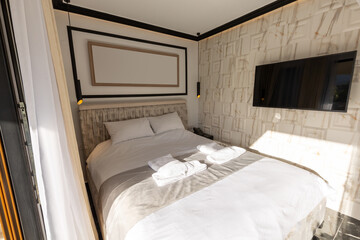 Fototapeta na wymiar Interior of a hotel bedroom in the morning