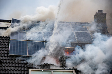 burning solar panel on roof