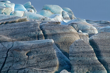 Icebergs colored by lava sand. Iceland.