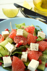 Concept of tasty food, salad with red orange, close up