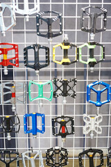 Bicycle pedals at shop stand