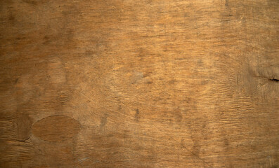 Photo of the texture of an old yellowed board.Vintage wood background for text. An old wooden wall.