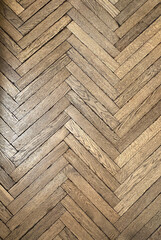 wooden parquet floor underfoot. The texture of the old parquet. The floor in the room is folded...