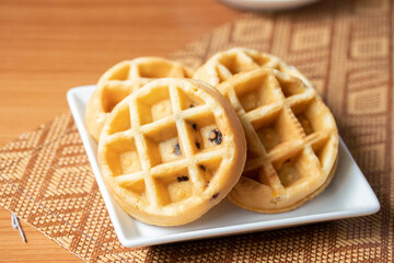 Breakfast vanilla waffles on a tray