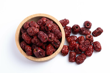 Dried Chinese jujube in a cup on white background. Isolated image.