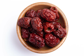 Dried Chinese jujube in a cup on white background. Isolated image.