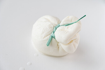burrata is a fresh italian cheese made from mozzarella and cream