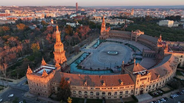 Morning view of Seville city and Plaza de Espana with Maria Luisa Park. Aerial view of Plaza de Espana - Spanish Square - at sunrise in Seville, Spain