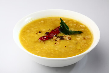 Indian food tuvar Daal or yellow lentil soup or curry in  ceramic bowl  