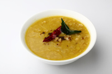 Indian food tuvar Daal or yellow lentil soup or curry in  ceramic bowl  