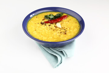 Indian food tuvar Daal or yellow lentil soup or curry in  ceramic bowl  