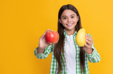 Fototapeta na wymiar smiling kid with apple and pear on yellow background