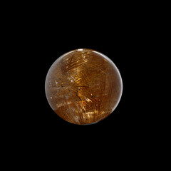 Ball of quartz with rutile on a black background