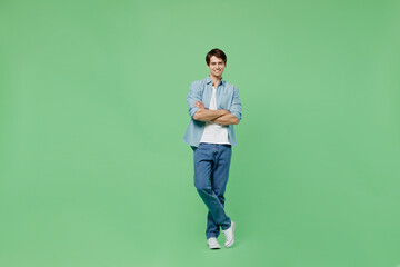 Full size body length overjoyed excited vivid young runet man 20s years old wears blue shirt hold...