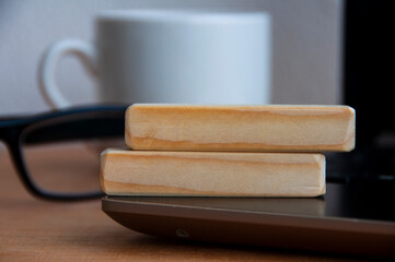 Blank wooden blocks on top of a laptop. Copy space concept