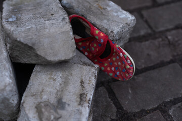 Kids shoes on representing civilian casualties in an active war zone