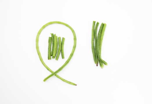 fresh yardlong bean pieces isolated on white background