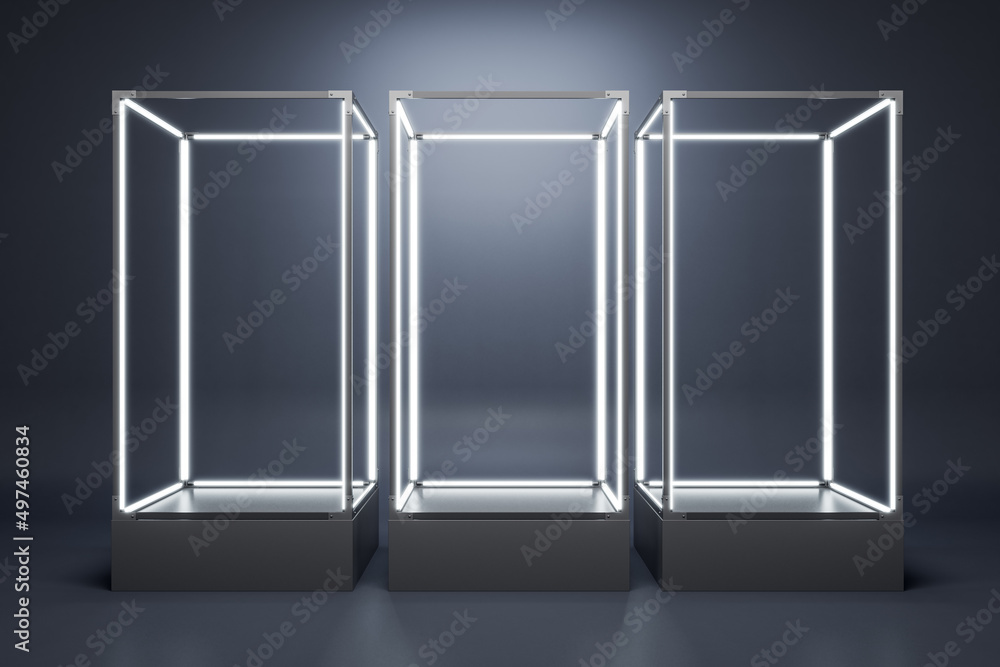 Leinwandbilder empty illuminated glass showcase with mock up place on gray wall background. 3d rendering.