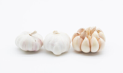 Whole garlic and cloves isolated on white background. Full depth of field.