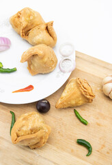 Singara isolated on wooden background