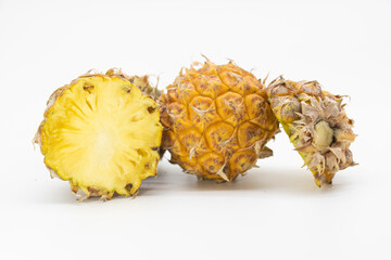 whole and slices pineapple isolated on white background, selective focus