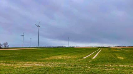 Electric wind turbine generating with blue sky and turbo generator