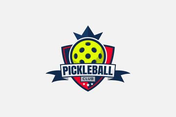 pickleball club logo with a ball, crown, shield, stars, and ribbon.