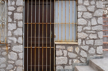 Closed and gated door of a bar during off-season in Italy
