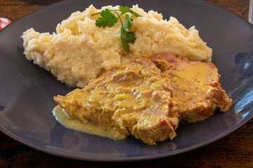 close up of biker style roast pork slices with mashed potatoes