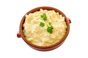 mashed potatoes in an earthen dish on a white background