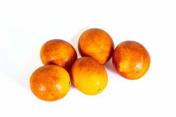 several blood oranges isolated on a white background