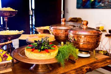 buffet with copper utensils
