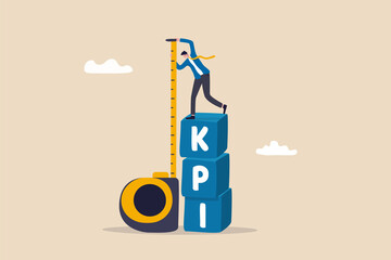 KPI, key performance indicator measurement to evaluate success or meet target, metric or data to review and improve business concept, businessman standing on top of KPI box measuring performance.