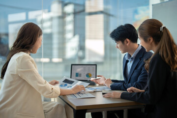 Business team meeting present, investor colleagues discussing new plan financial graph data on office table with laptop and digital tablet, Finance, accounting, investment
