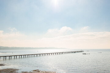 Long wooden pier protrudes into the lake